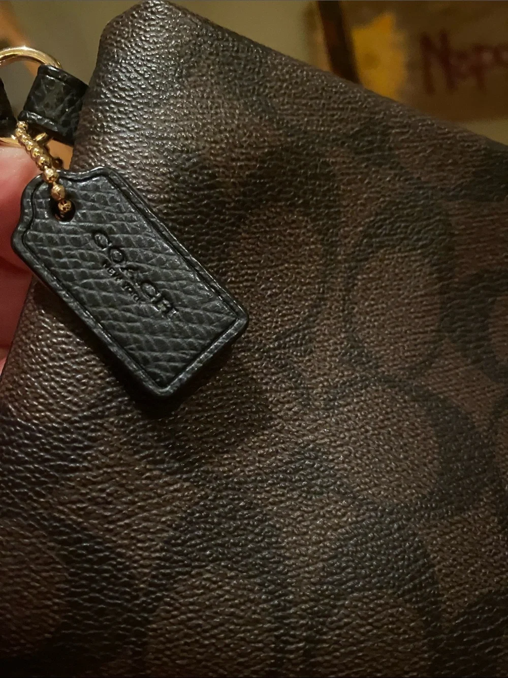 Coach Large Corner Zip Wristlet with signature brown canvas monogram